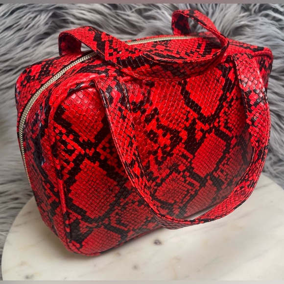 ipsy Handbags - NWOT Ipsy x Bailey Sarian Red Snake Print Makeup Bag